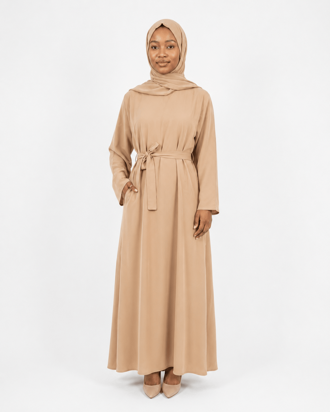 Jolie Nisa Abaya Beige Belted Nida Abaya | Includes Matching Hijab & Side Pockets Beige Belted Nida Abaya | Includes Matching Hijab & Side Pockets