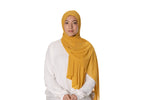 Load image into Gallery viewer, Jolie Nisa Hijab Mustard Elevate your style with the Non-Slip Bubble Chiffon Hijab by Jolie Nisa. With its comfortable and secure fit, this hijab is perfect for any occasion. Shop now! Jolie Nisa Non-Slip Premium Bubble Chiffon Hijab for All-Day Comfort 
